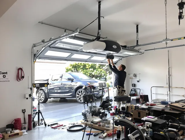 Eastvale Garage Door Repair specialist installing smart garage door opener system in Eastvale home